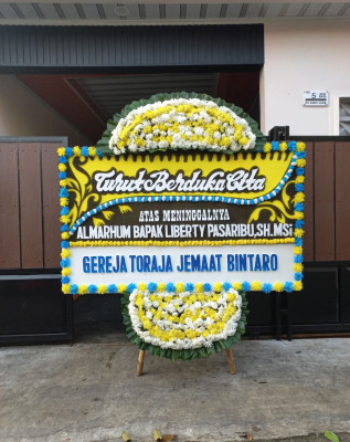 Papan Bunga Duka di Lola